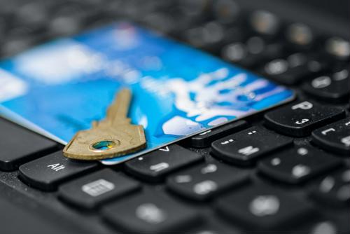 Key on a credit card on a laptop keyboard.